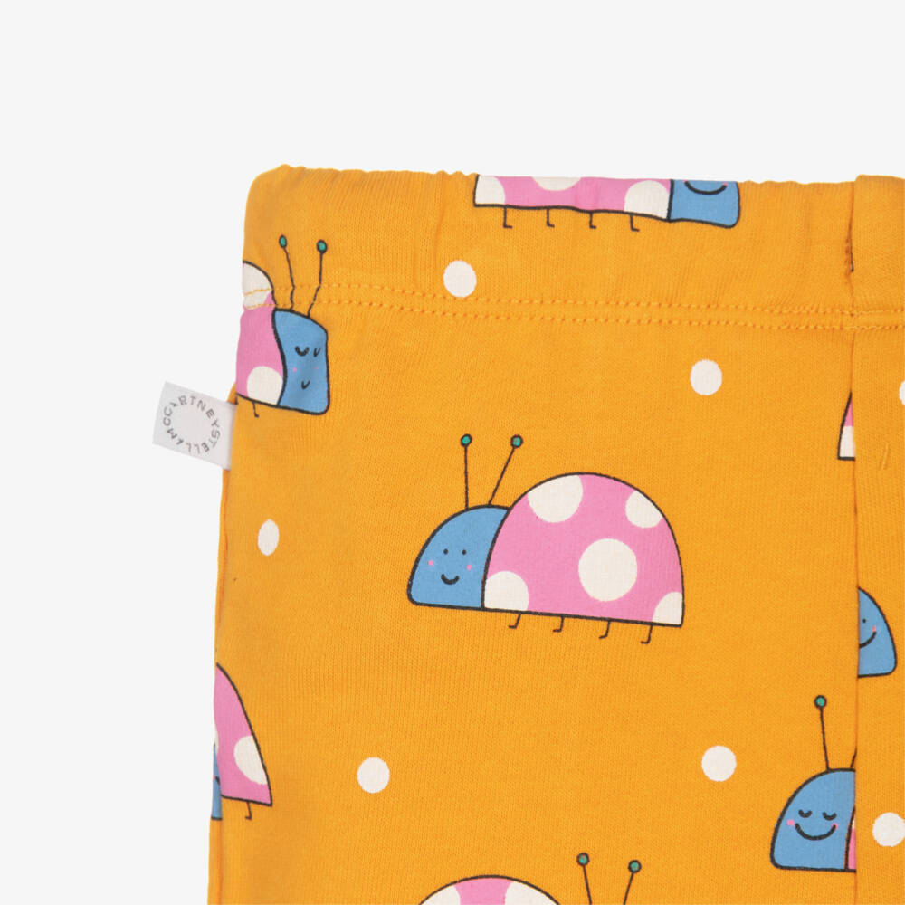 Stella McCartney Kids-بنطلون رياضي قطن بنقشة خنفساء لون برتقالي للبنات | Childrensalon