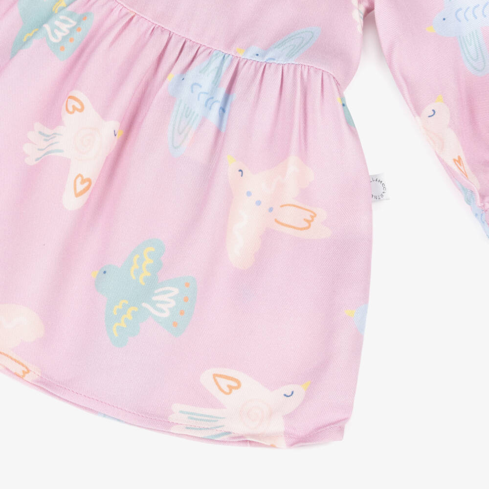 Stella McCartney Kids-Girls Pastel Pink Bird Print Long Sleeve Dress | Childrensalon
