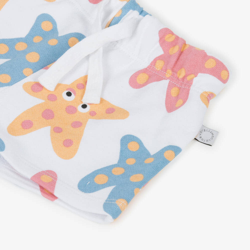 Stella McCartney Kids-Girls White Cotton Jersey Starfish Pattern Shorts | Childrensalon
