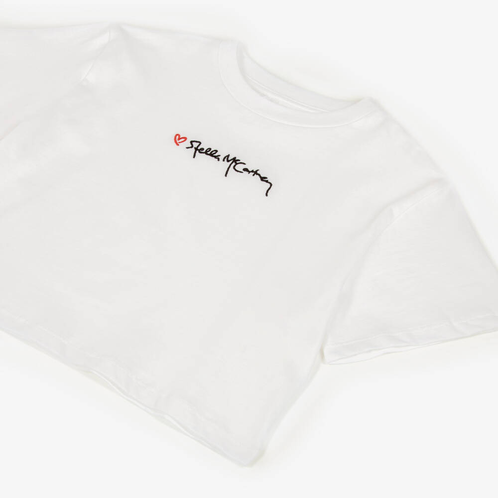 Stella McCartney Kids-Girls White Cotton T-Shirt with Heart & Script logo | Childrensalon