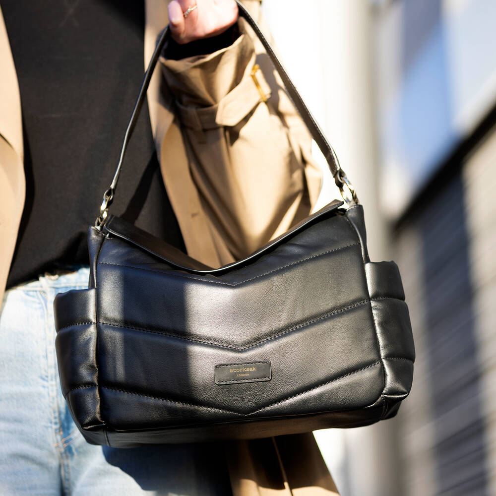 Storksak-حقيبة لمستلزمات الأطفال جلد لون أسود (32 سم) | Childrensalon