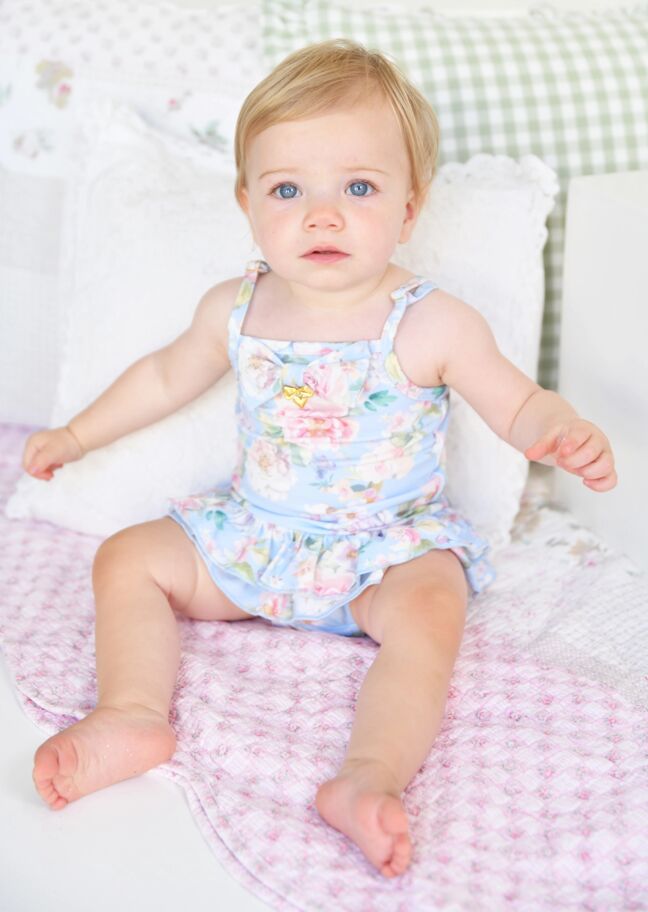 Baby boy wearing matching swimwear set for babies.